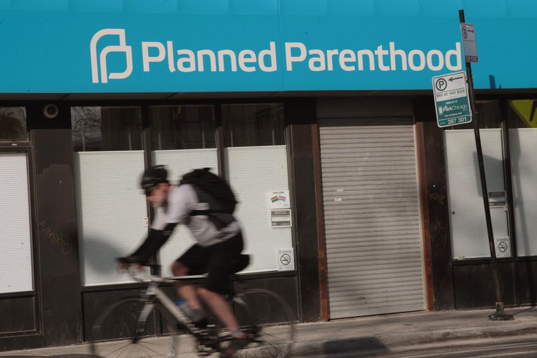 CHICAGO, IL - MAY 18: A cyclist rides past a Planned Parenthood clinic on May 18, 2018 in Chicago, Illinois. The Trump administration is expected to announce a plan for massive funding cuts to Planned Parenthood and other taxpayer-backed abortion providers by reinstating a Reagan-era rule that prohibits federal funding from going to clinics that discuss abortion with women or that share space with abortion providers. (Photo by Scott Olson/Getty Images)